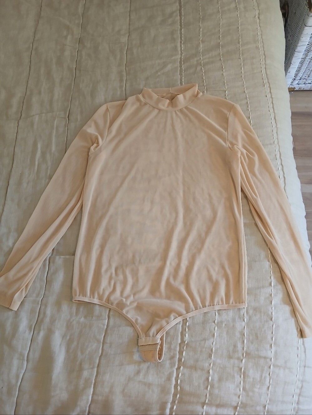 Woman Long Sleeve One-Piece Bodysuit in Light Peach